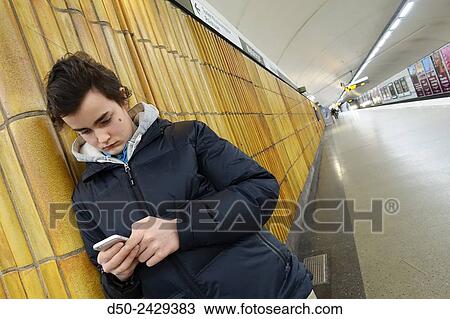 14 year old in subway with iPhone. Stockholm, Sweden View Large Photo Image Stock Image - 14 year old in subway with iPhone. Stockholm, Sweden. Fotosearch