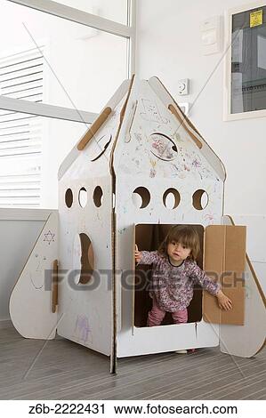 19 months old baby girl playing inside a cardboard rocket. View Large Photo Image Stock Image - 19 months old baby girl playing inside a cardboard rocket.. Fotosearch