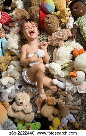 2 years old baby surrounded by stuffed toys. View Large Photo Image Stock Image - 2 years old baby surrounded by stuffed toys.. Fotosearch