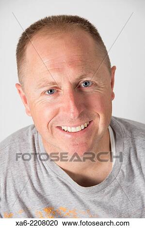 40 year old man smiles at the camera. View Large Photo Image Stock Image - 40 year old man smiles at the camera.. Fotosearch