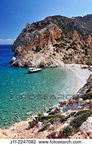 A beach on a desert Cyclades island, Polyaigios island, Cyclades, Greece. View Large Photo Image Stock Image - A beach on a desert Cyclades island, Polyaigios island, Cyclades, Greece.. Fotosearch