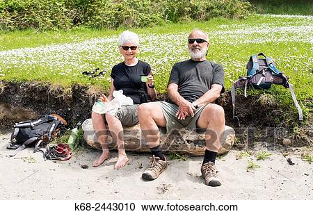 a couple, 68 and 77 years, sit at the beach in a park on Saturna Island, Gulf Islands, British Columbia, Canada. View Large Photo Image Stock Image - a couple, 68 and 77 years, sit at the beach in a park on Saturna Island, Gulf Islands, British Columbia, Canada.. Fotosearch