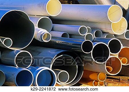 A stack of pipes at an industrial site, Greater Sudbury, Ontario, Canada. View Large Photo Image Stock Image - A stack of pipes at an industrial site, Greater Sudbury, Ontario, Canada.. Fotosearch