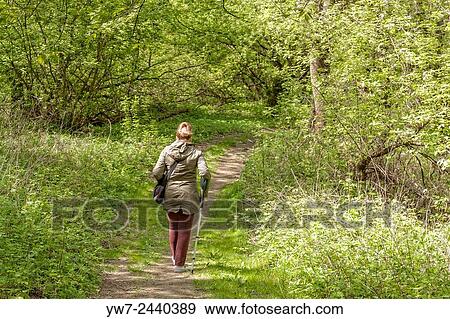 Adult woman having a walk on Vistula riverbank, Mlociny, Warsaw, Poland. View Large Photo Image Stock Photo - Adult woman having a walk on Vistula riverbank, Mlociny, Warsaw, Poland.. Fotosearch