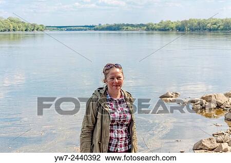 Adult woman on Vistula riverbank near Mlociny park, Warsaw, Poland. View Large Photo Image Stock Image - Adult woman on Vistula riverbank near Mlociny park, Warsaw, Poland.. Fotosearch
