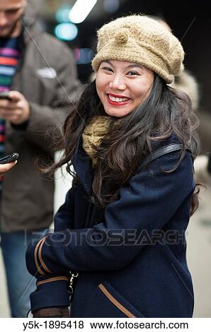 Amsterdam Airport, Netherlands. Young Asian woman waiting for her train. Editorial street-portrait. View Large Photo Image Stock Photo - Amsterdam Airport, Netherlands. Young Asian woman waiting for her train. Editorial street-portrait.. Fotosearch