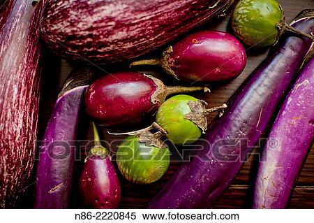Stock Photography - arranged eggplants on table top.. Fotosearch