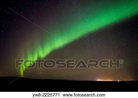 Stock Image - Aurora Borealis or Northern Lights by the town of Gardur, Reykjanes Peninsula, Iceland.. Fotosearch