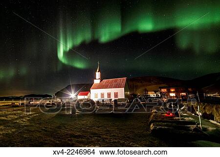 Picture - Aurora Borealis or northern Lights during winter at southern Iceland.. Fotosearch