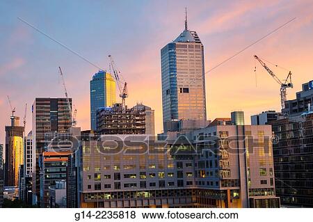 Australia, Victoria, Melbourne, Central Business District, CBD, high rise, buildings, city skyline, skyscrapers, economic development, under construction, cranes, sunset, dusk. View Large Photo Image Stock Photo - Australia, Victoria, Melbourne, Central Business District, CBD, high rise, buildings, city skyline, skyscrapers, economic development, under construction, cranes, sunset, dusk.. Fotosearch