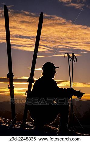 Backcountry skier silhouette at sunset, Hudson Bay Mountain, Smithers, British Columbia. View Large Photo Image Stock Photograph - Backcountry skier silhouette at sunset, Hudson Bay Mountain, Smithers, British Columbia.. Fotosearch