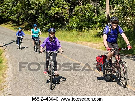 Stock Image - bicycling on Saturna Island, Gulf Islands, BC, Canada.. Fotosearch