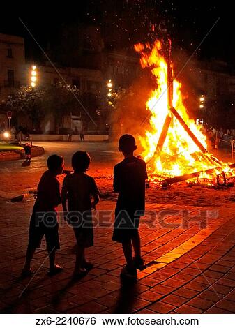 Bonfire of St. John’s Night (nit de Sant Joan) to celebrate Summer Solstice arrival at Sant Carles de la Rapita Village. Ebro River Delta Natural Park, Tarragona province, Catalonia, Spain. View Large Photo Image Stock Photograph - Bonfire of St. John’s Night (nit de Sant Joan) to celebrate Summer Solstice arrival at Sant Carles de la Rapita Village. Ebro River Delta Natural Park, Tarragona province, Catalonia, Spain.. Fotosearch