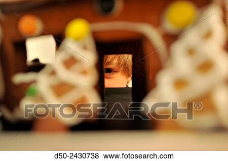 Boy looking through window of gingerbread house at Christmas. Stockholm, Sweden View Large Photo Image Stock Photo - Boy looking through window of gingerbread house at Christmas. Stockholm, Sweden. Fotosearch