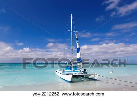 Catamaran in the shore, Waikiki Beach, O`ahu Island, Hawaii. USA. View Large Photo Image Stock Image - Catamaran in the shore, Waikiki Beach, O`ahu Island, Hawaii. USA.. Fotosearch