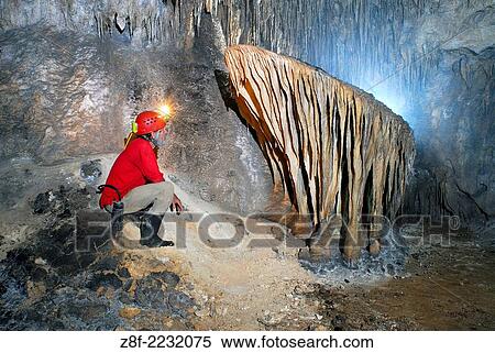 Caver Spelunking in Cuban Caves. View Large Photo Image Stock Photography - Caver Spelunking in Cuban Caves.. Fotosearch