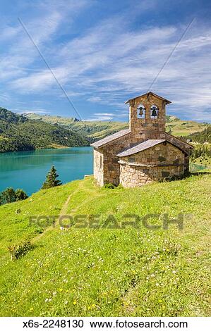 Stock Image - Chapelle de Roselend in the Barrage de Roselend - reservoir- near Beaufort in Savoie, Rhône-Alpes, France.. Fotosearch