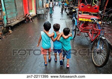 Stock Photography - Children walking on the street in Kolkata.. Fotosearch