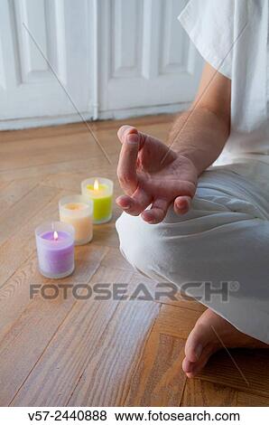 Close view of a man´s hand practising yoga, sitting in the lotus position. View Large Photo Image Stock Photo - Close view of a man´s hand practising yoga, sitting in the lotus position.. Fotosearch