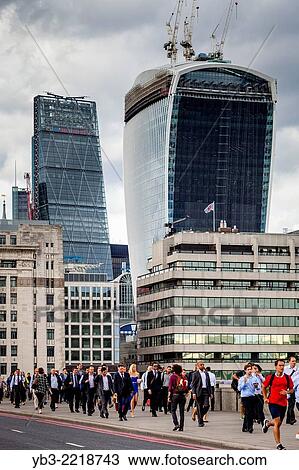 Commuters Crossing London Bridge During The Rush Hour, London, England. View Large Photo Image Stock Image - Commuters Crossing London Bridge During The Rush Hour, London, England.. Fotosearch