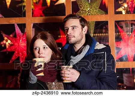 couple peer on christmas market. View Large Photo Image Stock Image - couple peer on christmas market.. Fotosearch
