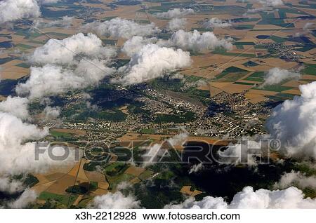 Cumulus clouds floating over fields patchwork, aerial view. View Large Photo Image Stock Photo - Cumulus clouds floating over fields patchwork, aerial view.. Fotosearch
