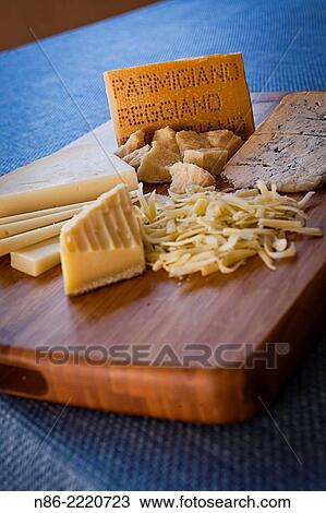 cutting board with various cheeses - parmesan. View Large Photo Image Stock Image - cutting board with various cheeses - parmesan.. Fotosearch