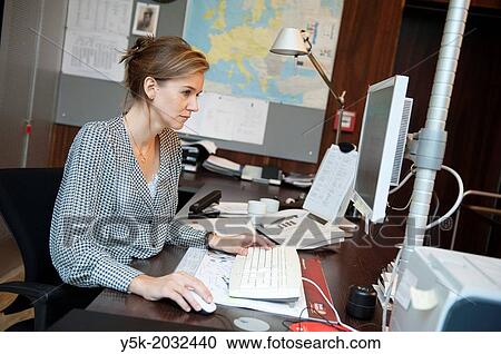 East-Berlin, Berlin, Germany. Young woman, working as a secretary at the office, supporting the vice-president of the cooperation. View Large Photo Image Stock Image - East-Berlin, Berlin, Germany. Young woman, working as a secretary at the office, supporting the vice-president of the cooperation.. Fotosearch