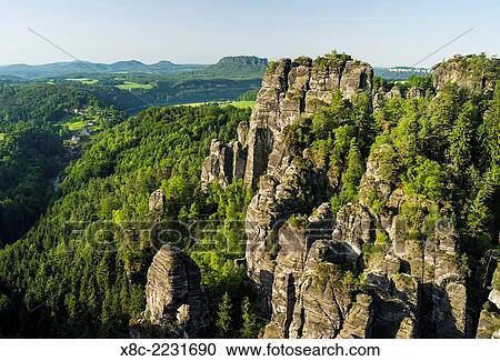 Elbe Sandstone Mountains (Elbsandsteingebirge) in the National Park Saxon Switzerland (Saechsische Schweiz). The rock formations called Grosse Gans (Great Goose) near village Rathen and Bastei Bridge. Europe, central europe, germany, saxony, June. View Large Photo Image Stock Image - Elbe Sandstone Mountains (Elbsandsteingebirge) in the National Park Saxon Switzerland (Saechsische Schweiz). The rock formations called Grosse Gans (Great Goose) near village Rathen and Bastei Bridge. Europe, central europe, germany, saxony, June.. Fotosearch