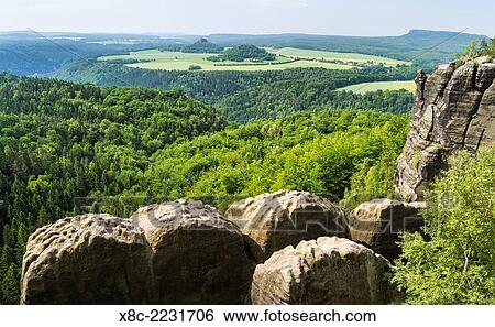 Elbe Sandstone Mountains (Elbsandsteingebirge) in the National Park Saxon Switzerland (Saechsische Schweiz). View over the valley of river Elbe from the rocks over the Breite Kluft. Europe, central europe, germany, saxony, June. View Large Photo Image Stock Photograph - Elbe Sandstone Mountains (Elbsandsteingebirge) in the National Park Saxon Switzerland (Saechsische Schweiz). View over the valley of river Elbe from the rocks over the Breite Kluft. Europe, central europe, germany, saxony, June.. Fotosearch