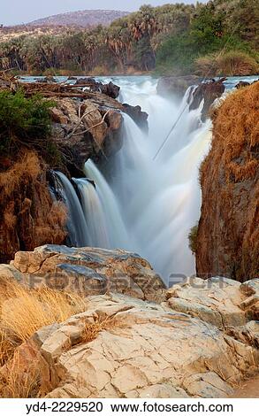 Epupa Falls, border of Angola and Namibia, Kaokoland area, Kunene region, Namibia,. View Large Photo Image Stock Image - Epupa Falls, border of Angola and Namibia, Kaokoland area, Kunene region, Namibia,.. Fotosearch