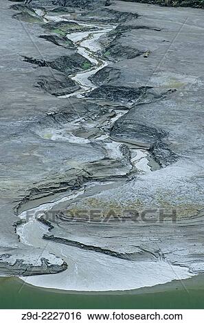 Stock Photograph - Erosion in old tailings pond, Premier gold mine, Stewart, British Columbia.. Fotosearch