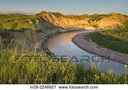 Evening light over the Little Missouri River, Theodore Rossevelt National Park, North Dakota. View Large Photo Image Stock Photo - Evening light over the Little Missouri River, Theodore Rossevelt National Park, North Dakota.. Fotosearch