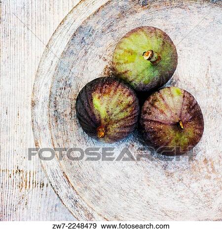 Stock Photo - Figs on wooden plate.. Fotosearch