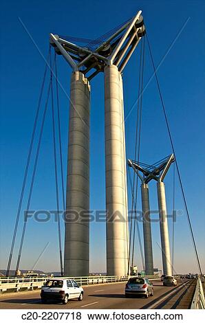 Stock Photo - Flaubert bridge with cars, Rouen Commerce Harbour, River Seine, Rouen, upper Normandy, 76000, France.. Fotosearch