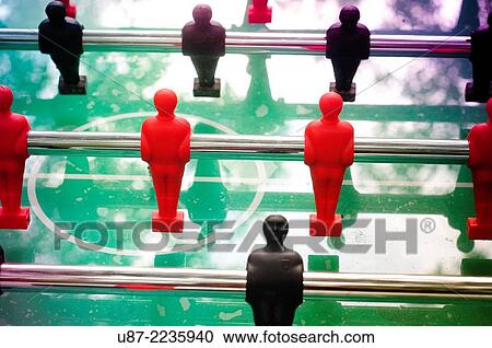 Stock Image - Foosball Table with Red and Black Figures.. Fotosearch