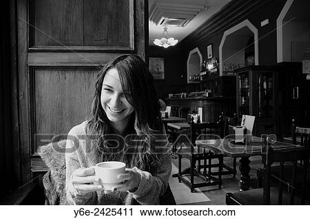 Stock Image - Girl in the cafeteria.. Fotosearch
