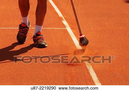 Groundskeeper Rakes Cay Tennis Court. View Large Photo Image Stock Image - Groundskeeper Rakes Cay Tennis Court.. Fotosearch