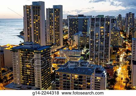 Hawaii, Hawaiian, Honolulu, Waikiki Beach, Pacific Ocean, Kuhio Avenue, high rise buildings, hotels, condominium, dusk, night, city skyline. View Large Photo Image Stock Photo - Hawaii, Hawaiian, Honolulu, Waikiki Beach, Pacific Ocean, Kuhio Avenue, high rise buildings, hotels, condominium, dusk, night, city skyline.. Fotosearch