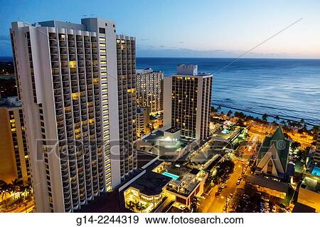 Hawaii, Hawaiian, Honolulu, Waikiki Beach, Pacific Ocean, high rise buildings, hotels, condominium, dusk, night, city skyline, Marriott Resort & and Spa. View Large Photo Image Stock Photo - Hawaii, Hawaiian, Honolulu, Waikiki Beach, Pacific Ocean, high rise buildings, hotels, condominium, dusk, night, city skyline, Marriott Resort & and Spa.. Fotosearch