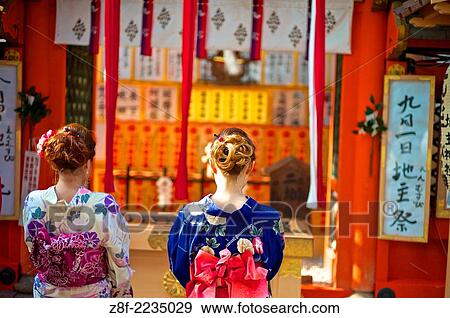 Japanese woman wearing traditional kimonos entering the? Love Shrine? at the Kiyomizu Temple. View Large Photo Image Stock Photo - Japanese woman wearing traditional kimonos entering the? Love Shrine? at the Kiyomizu Temple.. Fotosearch