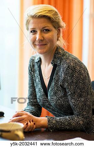 Klosterstrasse, East-Berlin, Berlin, Germany. Mid adult female diplomat, working at the political department of the Dutch embassy, monitoring developments within German politics. View Large Photo Image Stock Image - Klosterstrasse, East-Berlin, Berlin, Germany. Mid adult female diplomat, working at the political department of the Dutch embassy, monitoring developments within German politics.. Fotosearch