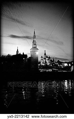 Stock Image - Kremlin and St. Basil´s Cathedral at night seen across Moskva River, Moscow.. Fotosearch