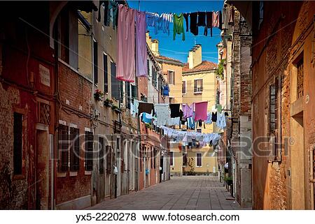 Stock Photo - Laundry hanging across a narrow street in Venice, Italy.. Fotosearch