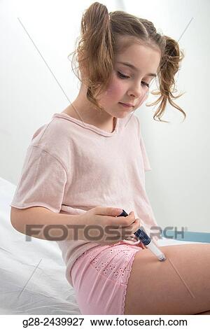 Little girl with bunches suffering from diabetes injecting herself insulin View Large Photo Image Stock Photo - Little girl with bunches suffering from diabetes injecting herself insulin. Fotosearch