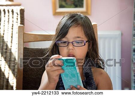 Little girl with smart phone. View Large Photo Image Stock Image - Little girl with smart phone.. Fotosearch