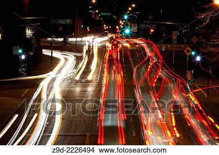 Picture - Long exposure of traffic at night in downtown Vancouver, British Columbia.. Fotosearch