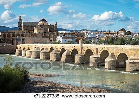 Looking across the Guadalquivir river and Roman bridge to the cathedral and historic centre of Cordoba, Andalucia, Spain. View Large Photo Image Stock Photography - Looking across the Guadalquivir river and Roman bridge to the cathedral and historic centre of Cordoba, Andalucia, Spain.. Fotosearch