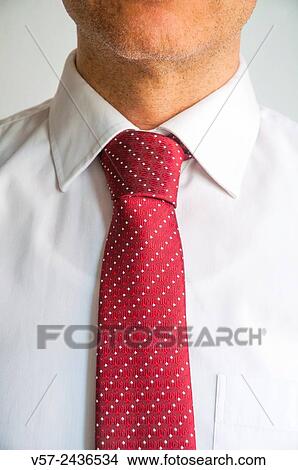 Man wearing red tie on white shirt. Close view. View Large Photo Image Picture - Man wearing red tie on white shirt. Close view.. Fotosearch