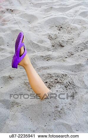 Mannequin Legs Sticking Up Out of Sand. View Large Photo Image Stock Image - Mannequin Legs Sticking Up Out of Sand.. Fotosearch